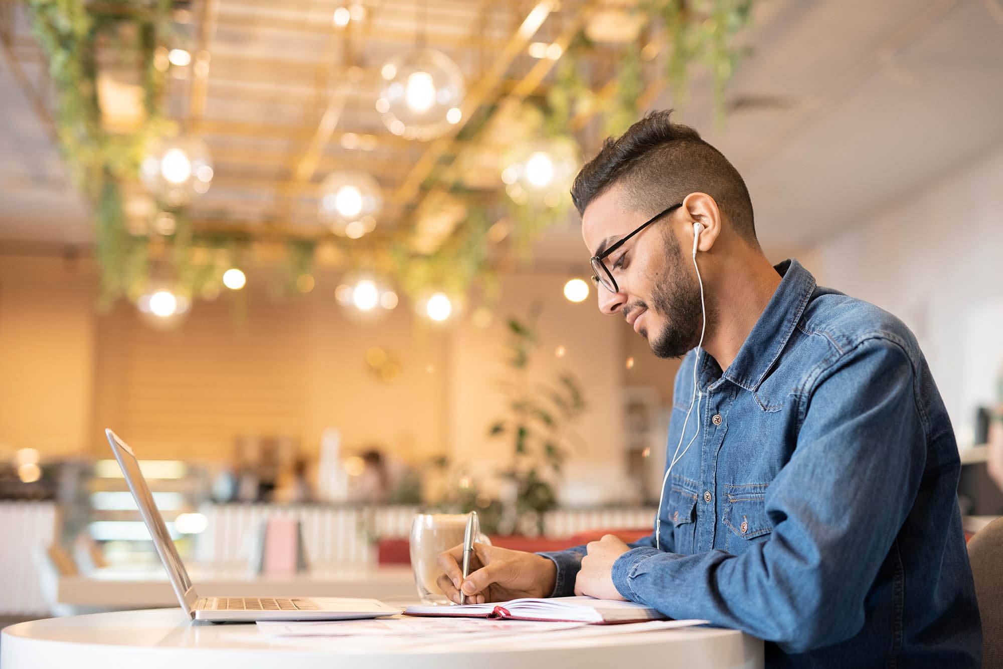 young-man-studying-in-a-cafe
